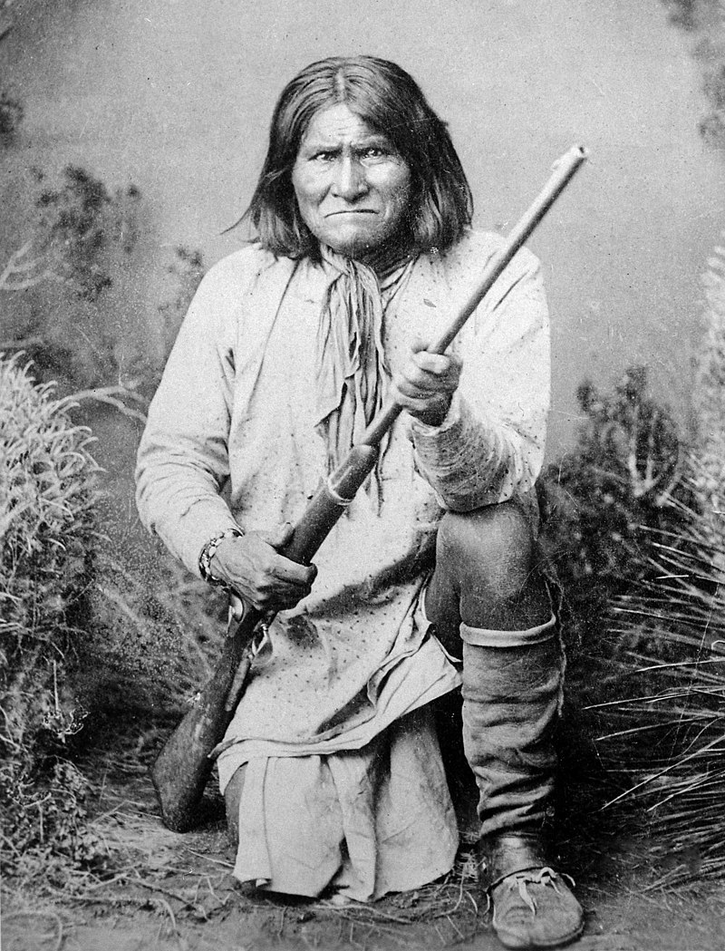 Geronimo Goyathlay a Chiricahua Apache full length kneeling with rifle 1887 NARA 530880