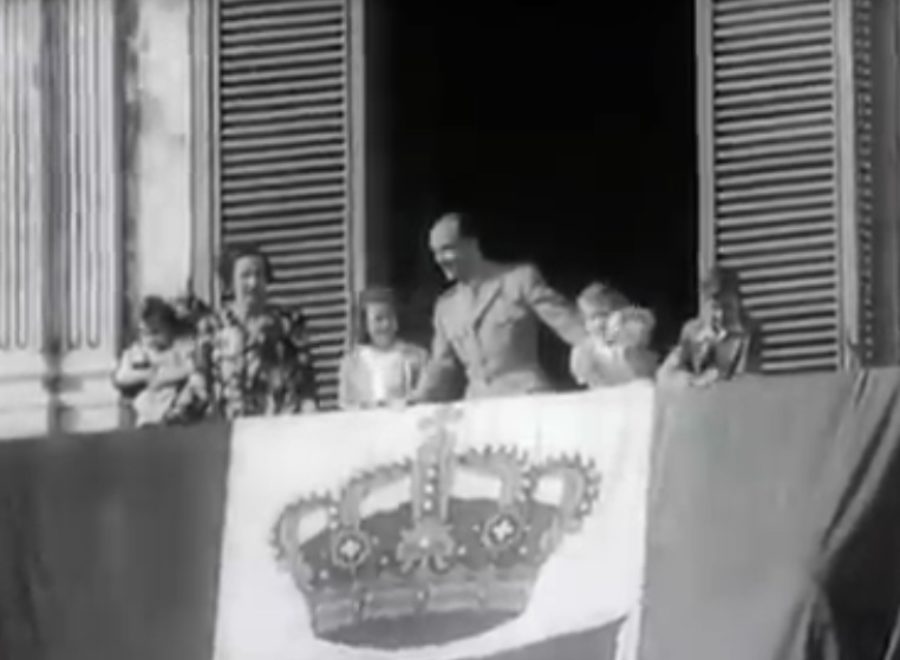 King Umberto II behind of the Flag of Kingdom of Italy