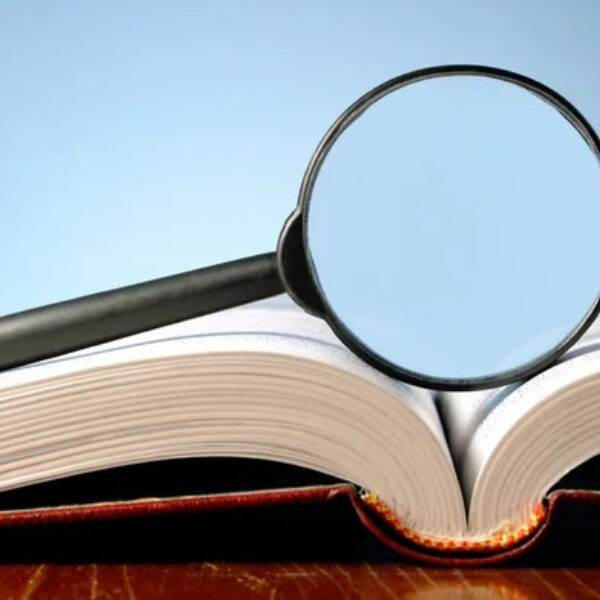 Depositphotos 8913595 stock photo book and a magnifying glass