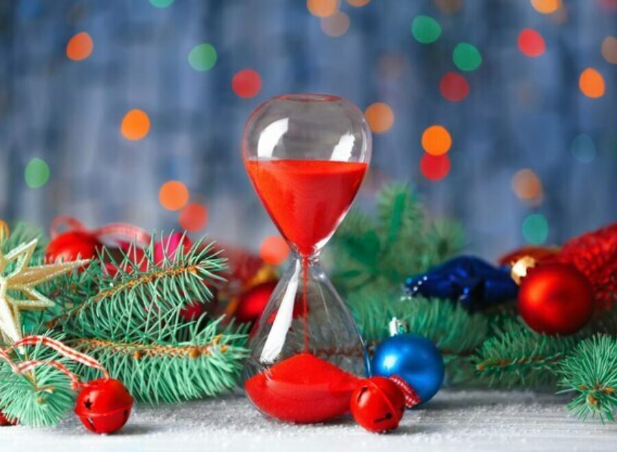 Hourglass fir tree branches against defocused lights christmas countdown concept 392895 55895