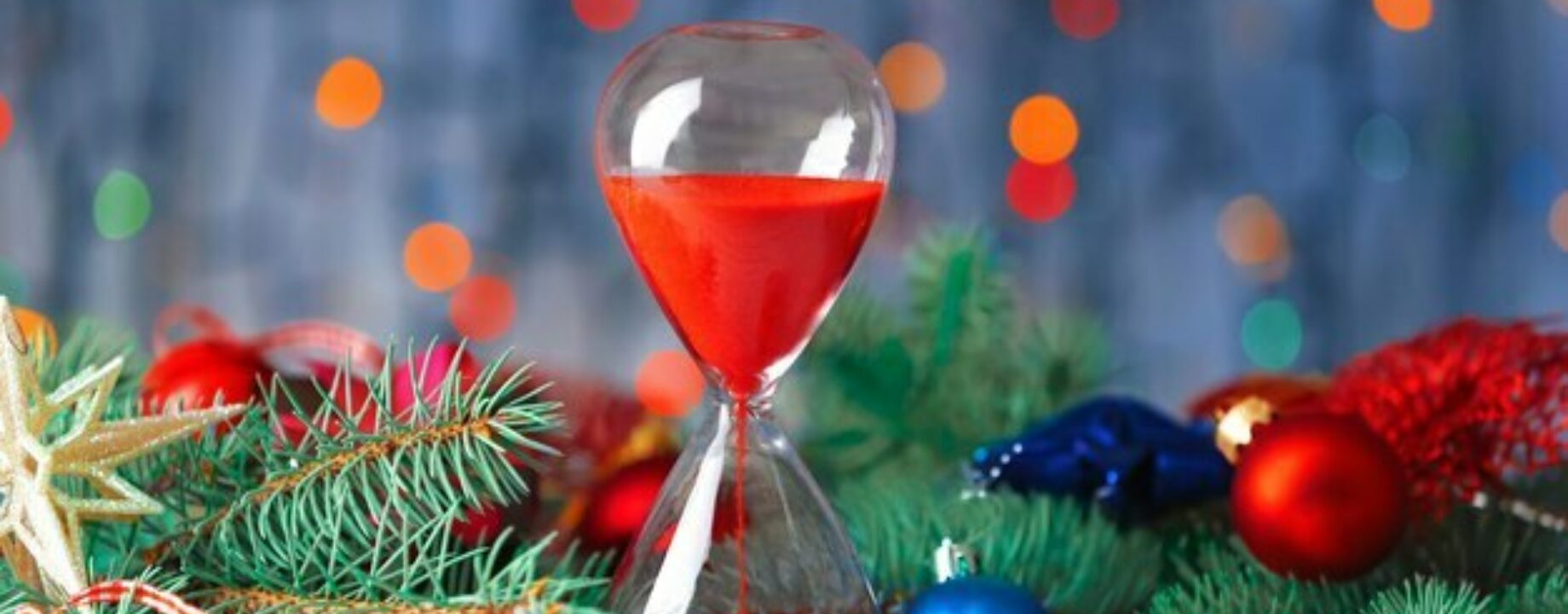 Hourglass fir tree branches against defocused lights christmas countdown concept 392895 55895