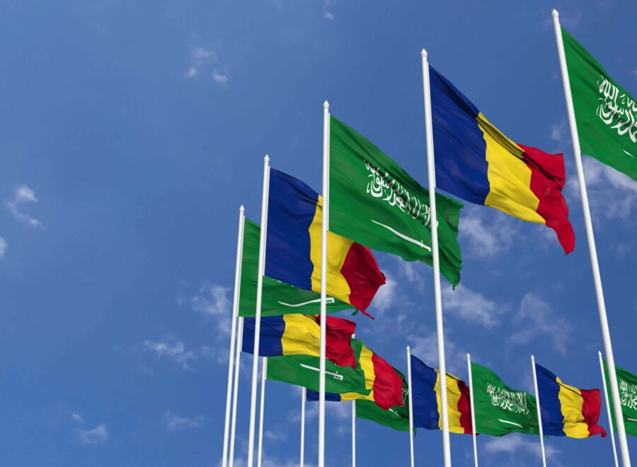 Romania and ksa kingdom of saudi arabia flags waving together in the sky seamless loop in wind space on left side for design or information 3d rendering free video